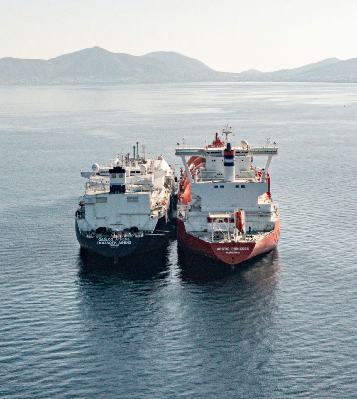 LNG carrier moored alongside a shuttle tanker during a ship-to-ship transfer